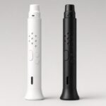 Two electronic wind instruments, one white and one black, side by side